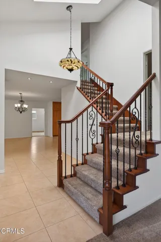 an empty room with windows and entrance