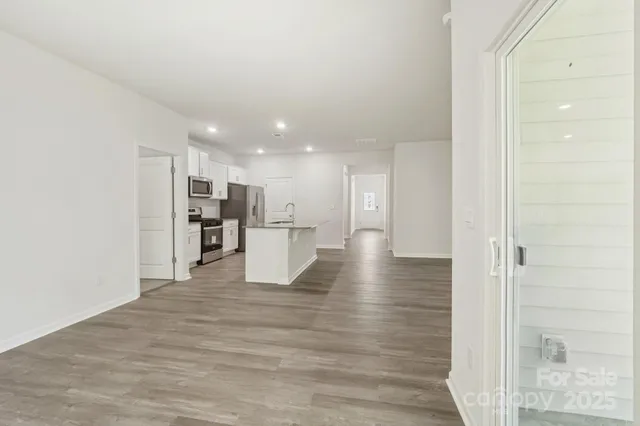 a view of a kitchen with wooden floor