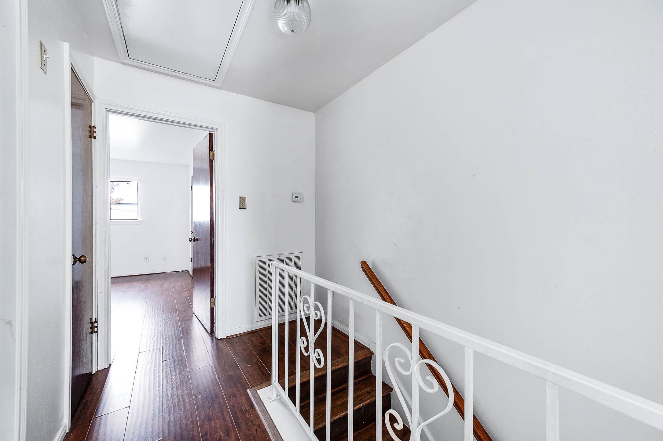 1609 Mapleton Drive Houston, TX 77043 - Photo 12 of 21 a view of a hallway with wooden floor