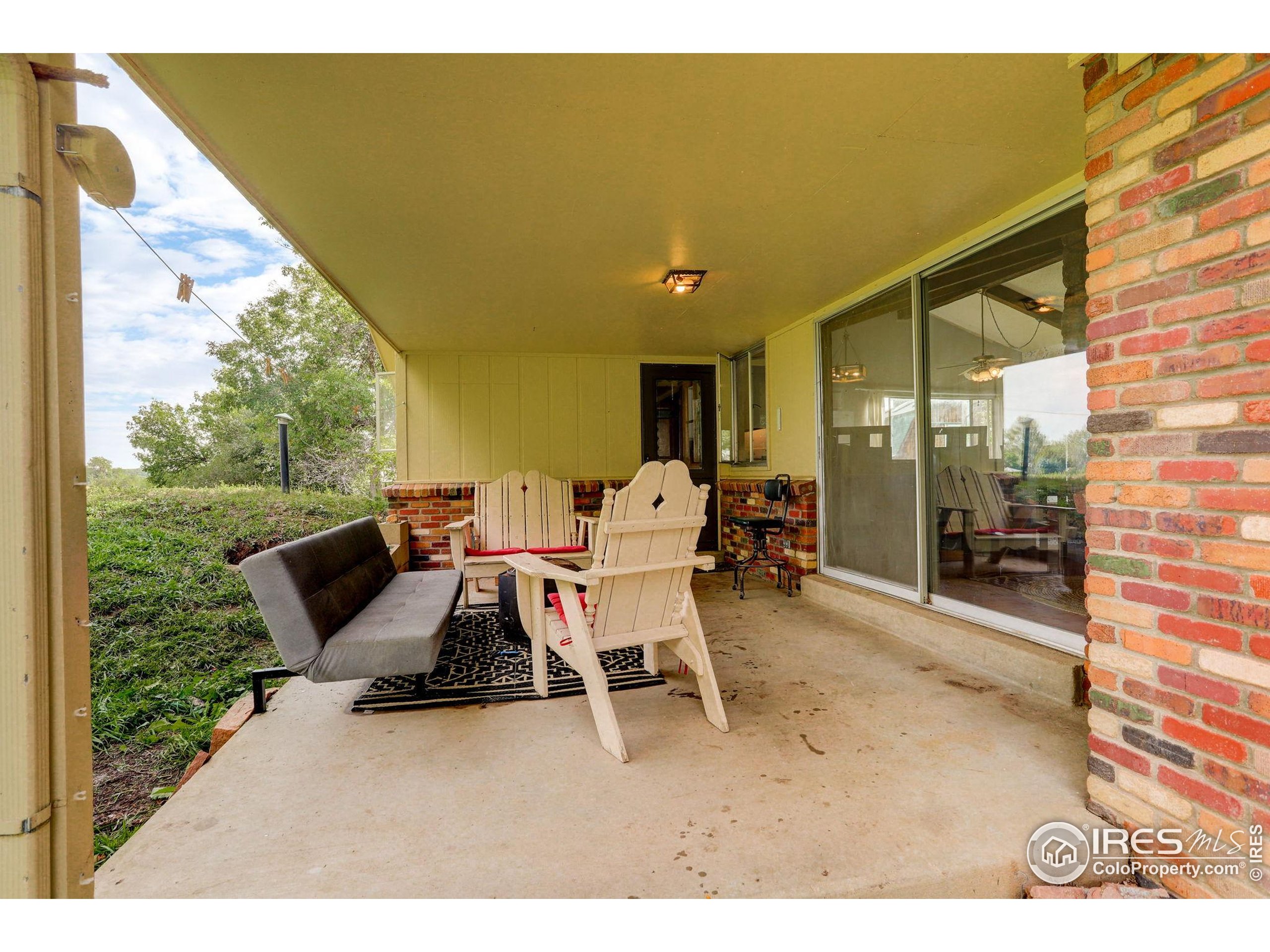 3625 Nimbus Road Longmont, CO 80503 - Photo 21 of 48 a view of a patio with table and chairs and potted plants