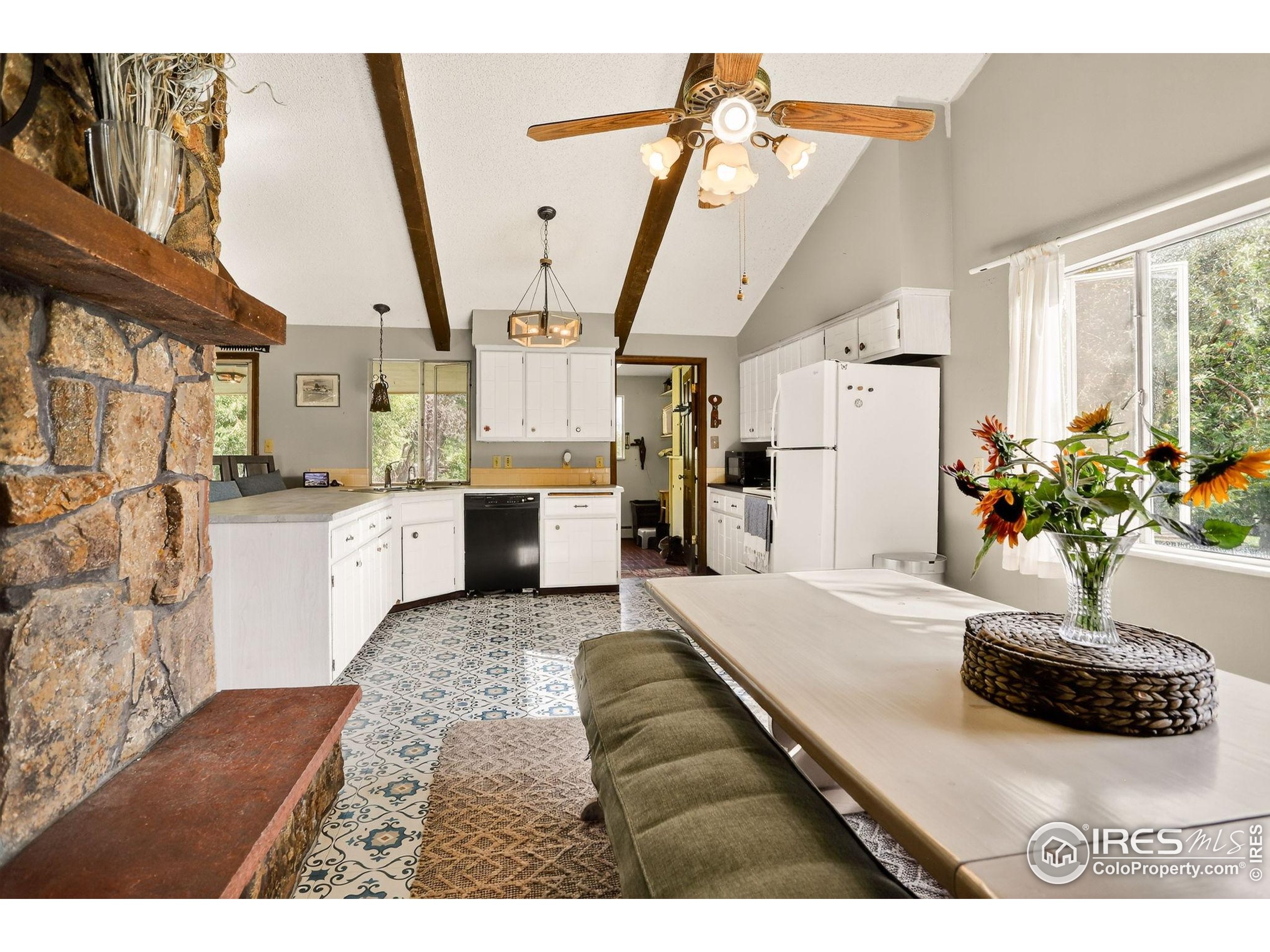 3625 Nimbus Road Longmont, CO 80503 - Photo 9 of 48 a living room with furniture and a chandelier
