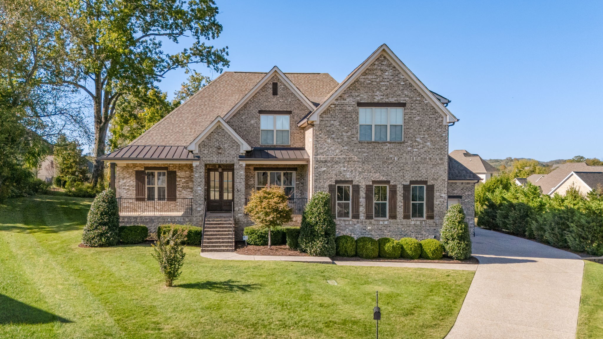 4016 Pinwheel Court Arrington, TN 37014 - Photo 1 of 47 a front view of a house with a yard and garage