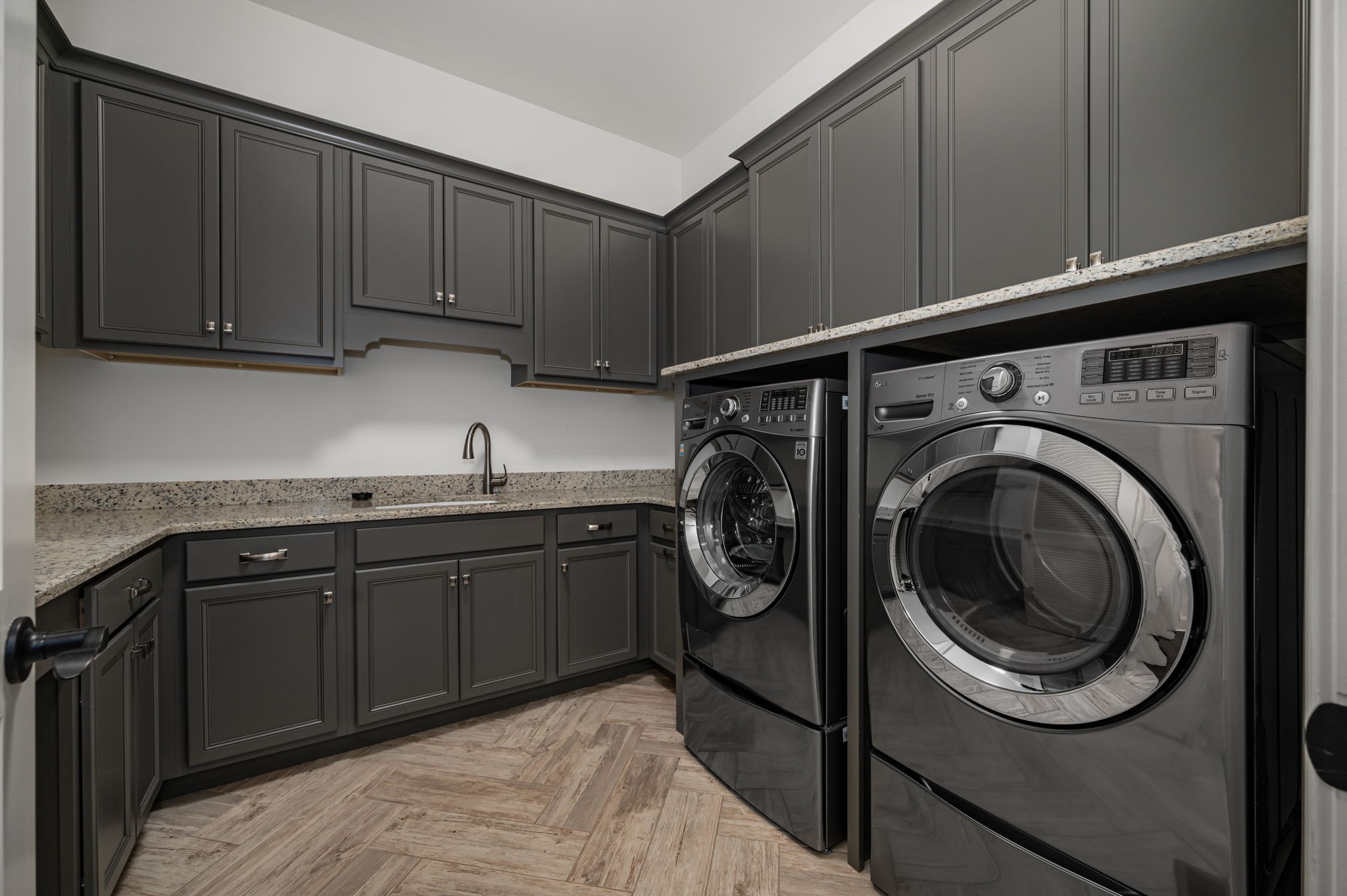 4016 Pinwheel Court Arrington, TN 37014 - Photo 22 of 47 a kitchen with stainless steel appliances granite countertop a sink and cabinets