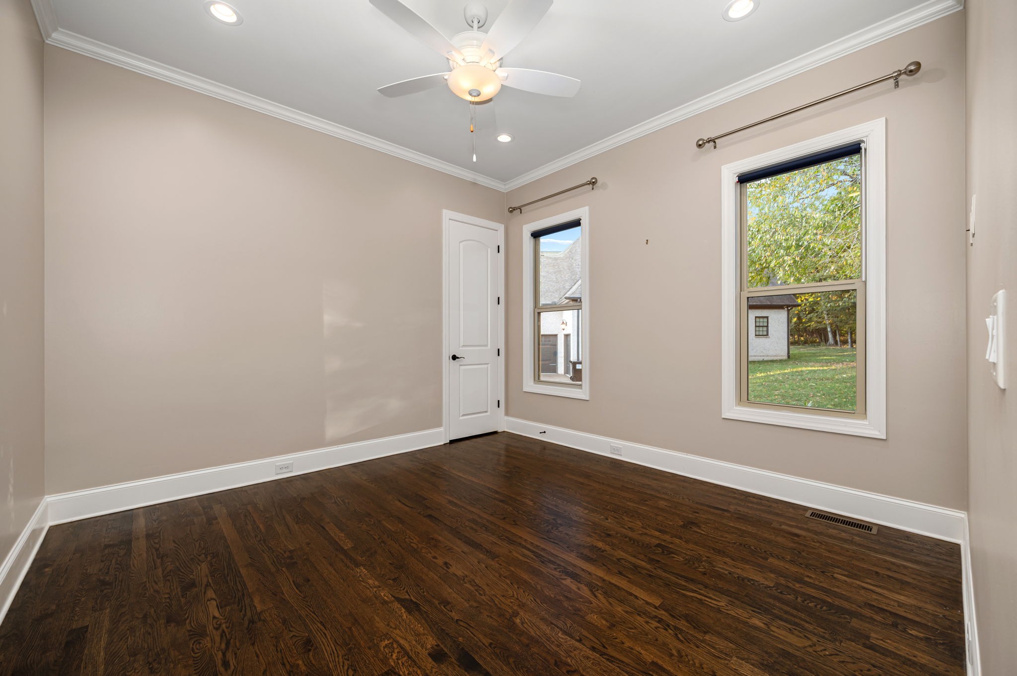 4016 Pinwheel Court Arrington, TN 37014 - Photo 29 of 47 an empty room with wooden floor and windows