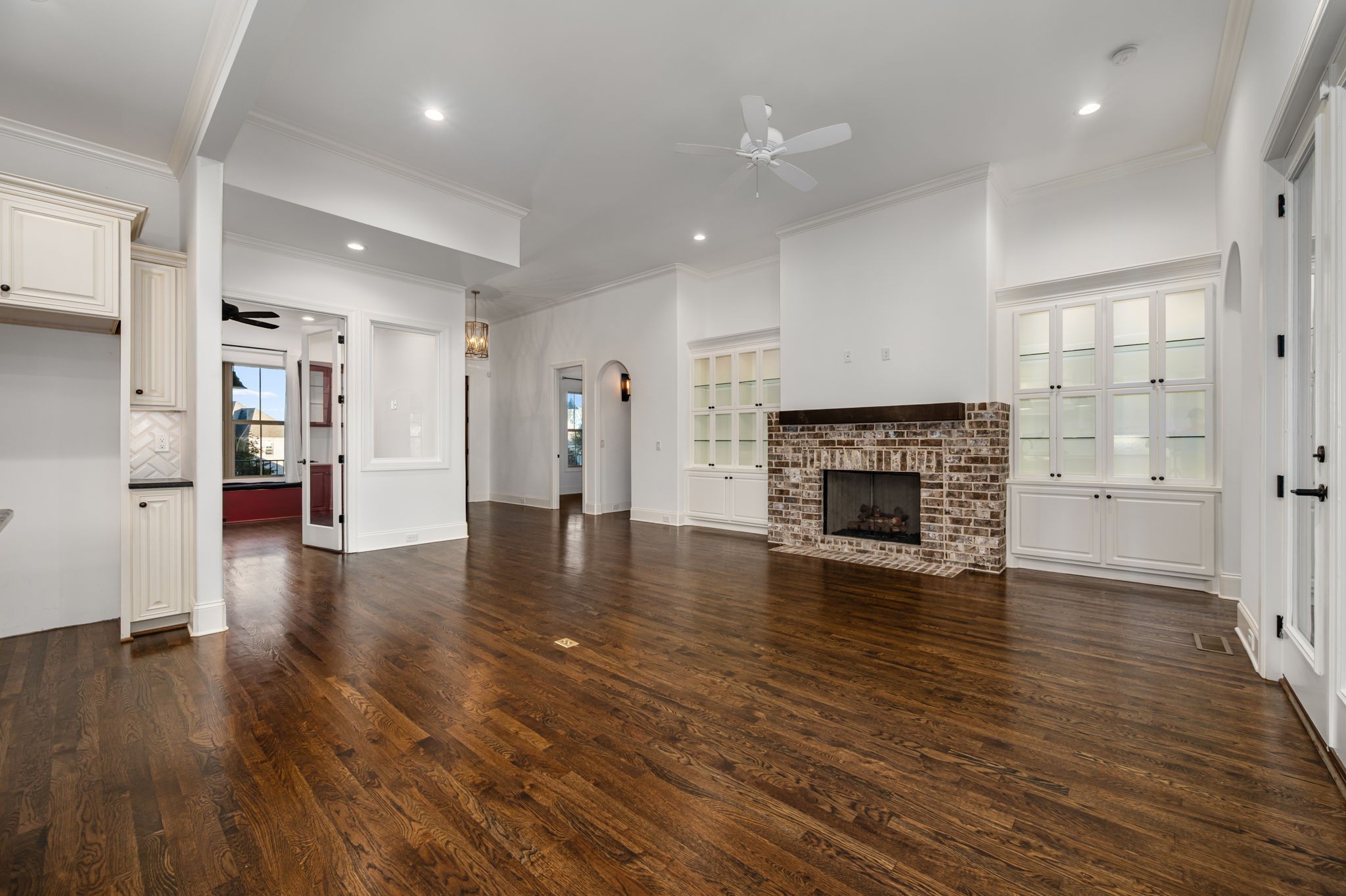 4016 Pinwheel Court Arrington, TN 37014 - Photo 10 of 47 a view of a livingroom with a fireplace wooden floor and window