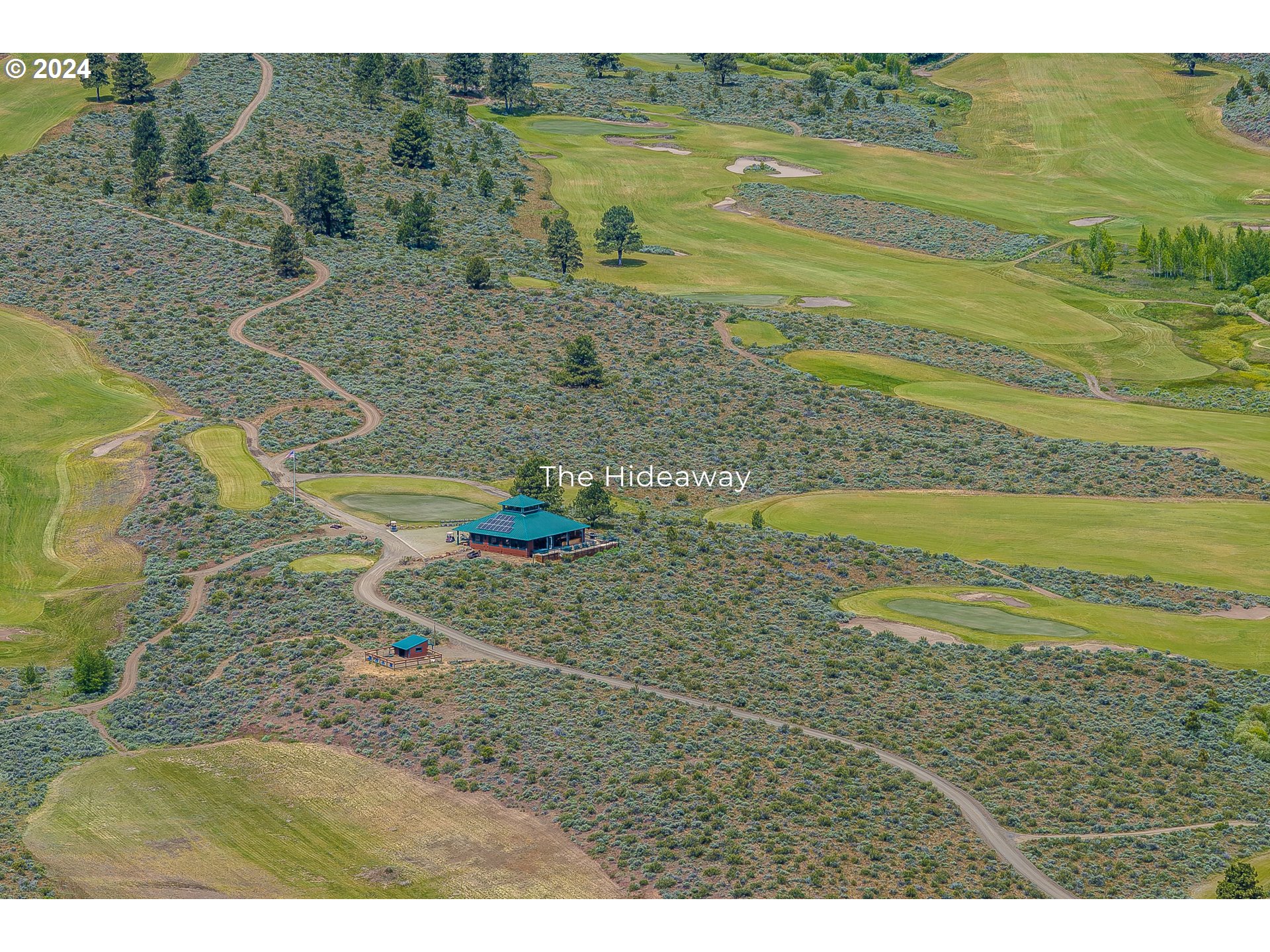 20184 Riata Lane, Unit S1 Seneca, OR 97873 - Photo 7 of 9 a view of a lake with a mountain