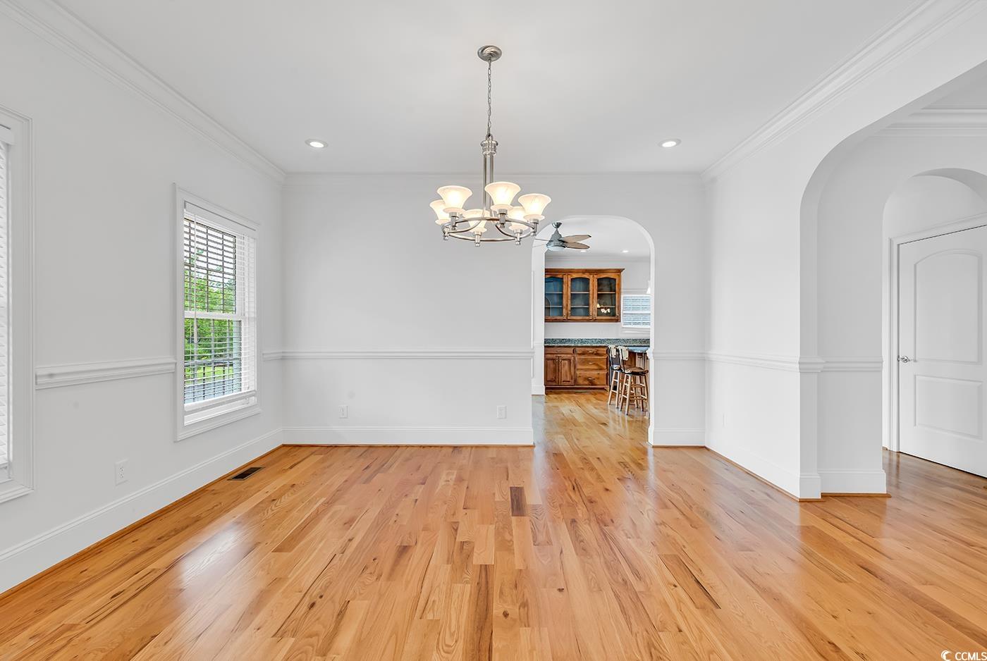 70 Highwood Circle Murrells Inlet, SC 29576 - Photo 10 of 40 Unfurnished dining area with ornamental molding, l