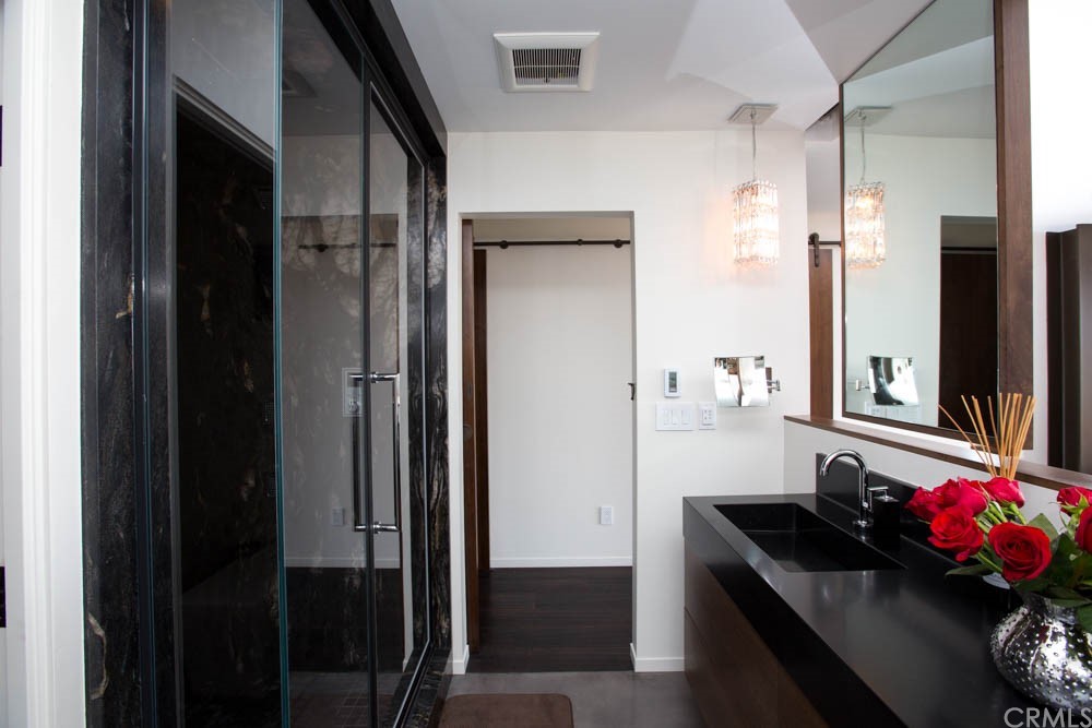 1839 Strand Way Oceano, CA 93445 - Photo 11 of 47 a bathroom with a sink vanity and a mirror
