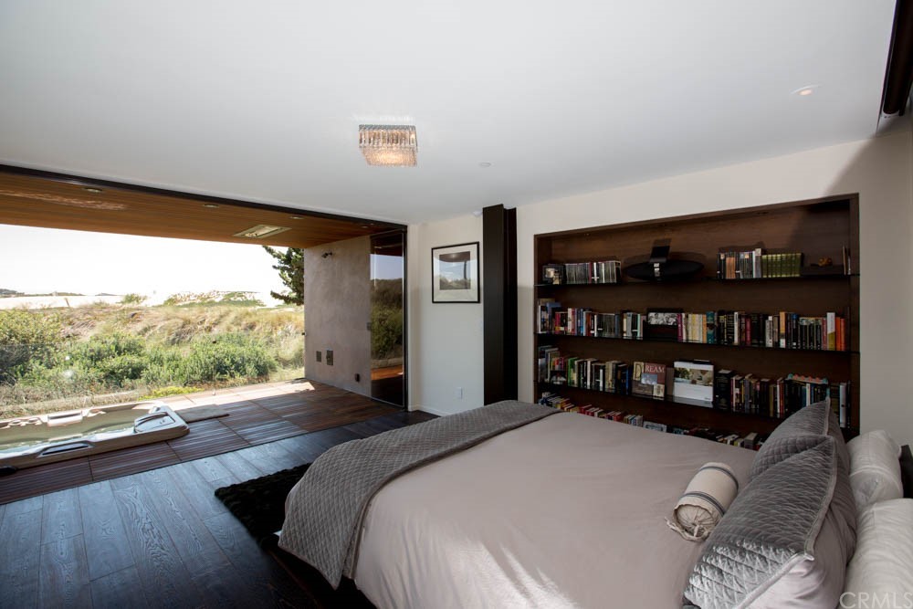 1839 Strand Way Oceano, CA 93445 - Photo 12 of 47 a bedroom with a large bed and a large window