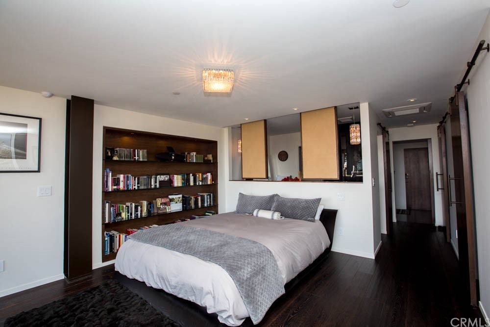 1839 Strand Way Oceano, CA 93445 - Photo 15 of 47 a bedroom with a bed and closet