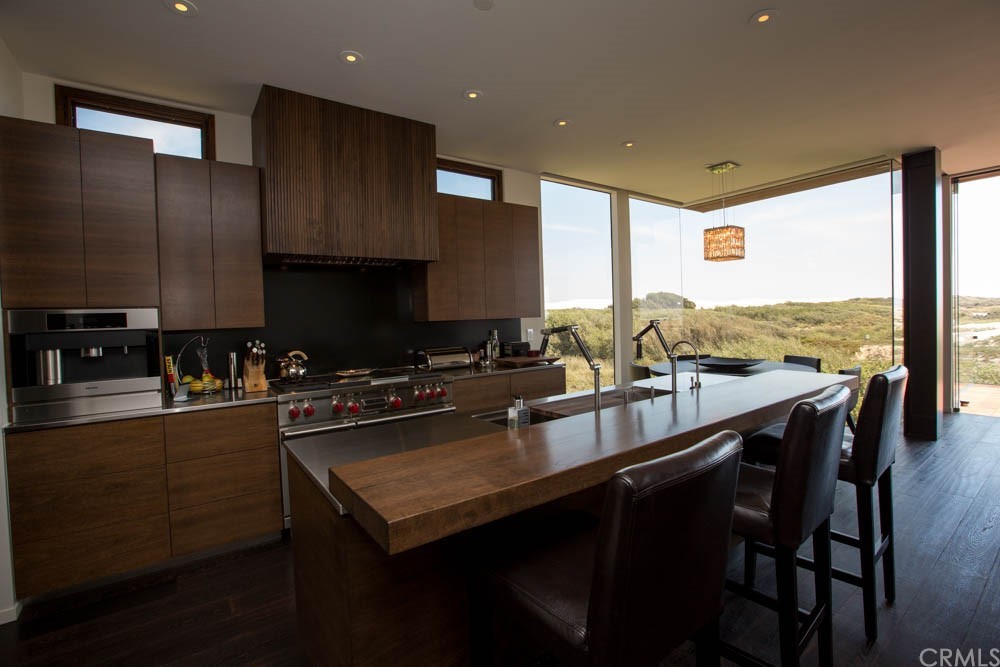 1839 Strand Way Oceano, CA 93445 - Photo 17 of 47 a kitchen with a sink stove and cabinets