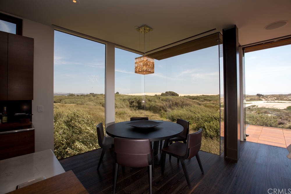 1839 Strand Way Oceano, CA 93445 - Photo 18 of 47 a view of a dining room with furniture window and wooden floor