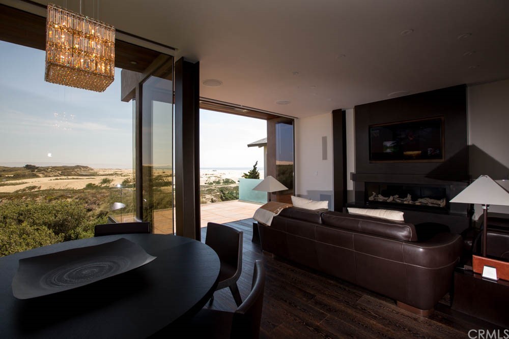 1839 Strand Way Oceano, CA 93445 - Photo 19 of 47 a living room with furniture tv and large window