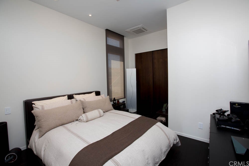 1839 Strand Way Oceano, CA 93445 - Photo 25 of 47 a bedroom with a bed and a table