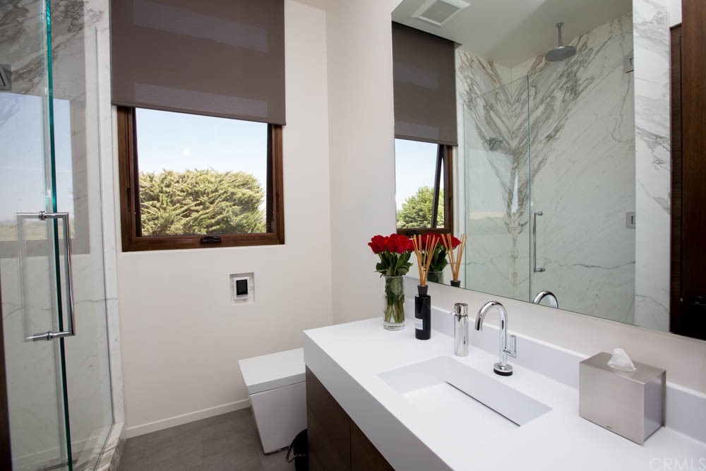 1839 Strand Way Oceano, CA 93445 - Photo 27 of 47 a bathroom with a sink and a mirror