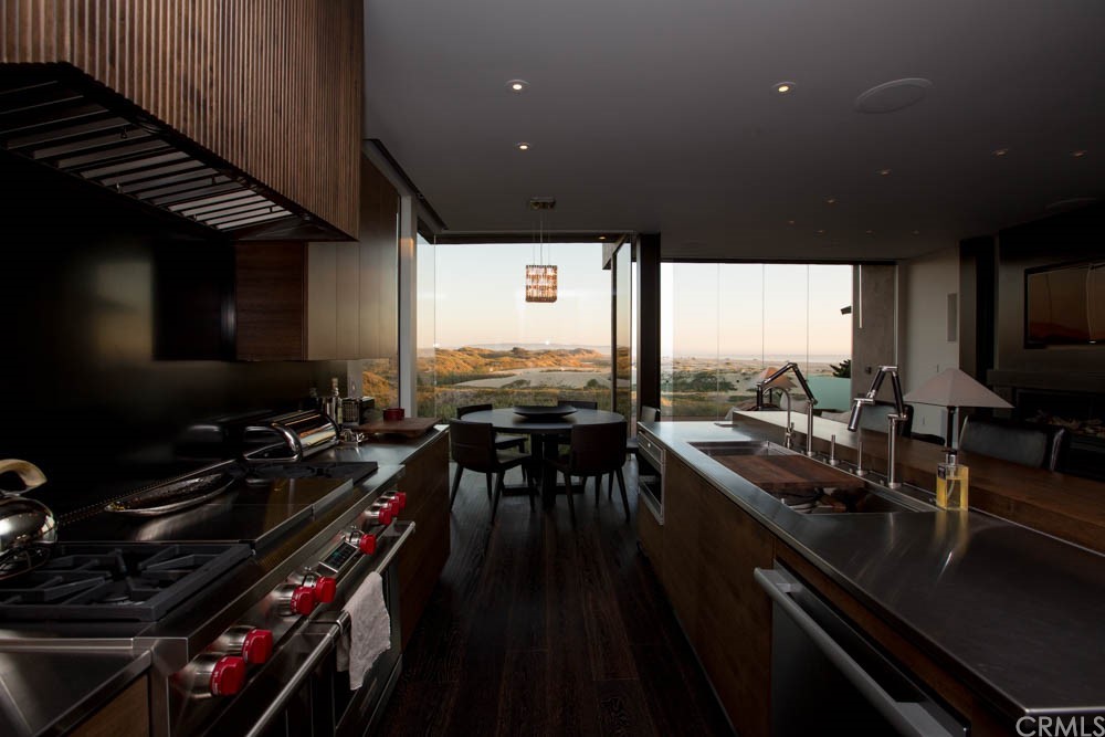 1839 Strand Way Oceano, CA 93445 - Photo 36 of 47 a kitchen with stainless steel appliances a sink stove and cabinets