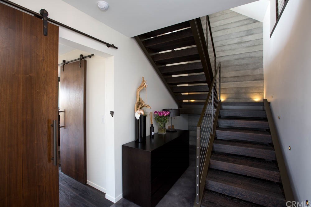 1839 Strand Way Oceano, CA 93445 - Photo 9 of 47 a view of hallway with stairs and wooden floor