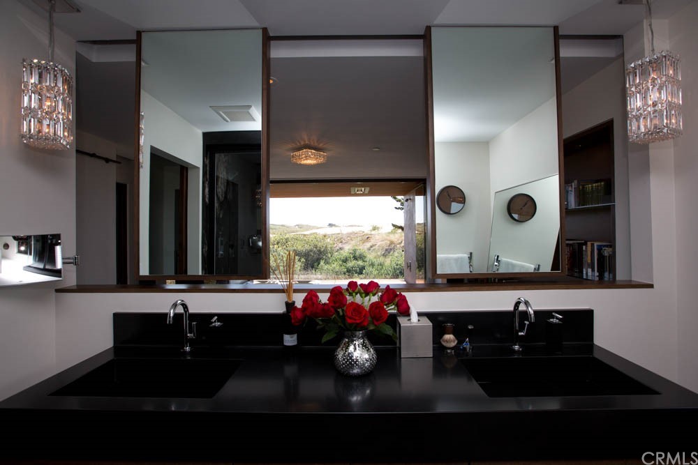 1839 Strand Way Oceano, CA 93445 - Photo 10 of 47 a bathroom with a sink and a mirror