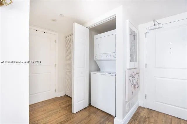 a view of bathroom with a toilet a sink and a mirror