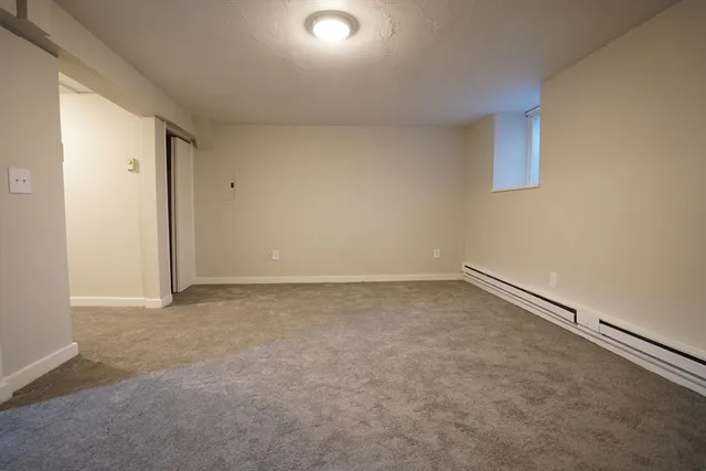 an empty room with a empty space and windows