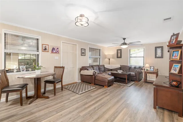 a kitchen with microwave a stove and cabinets
