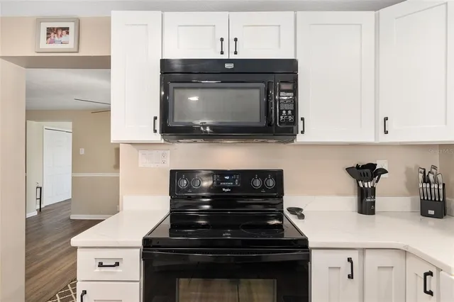 a view of a living room filled with furniture