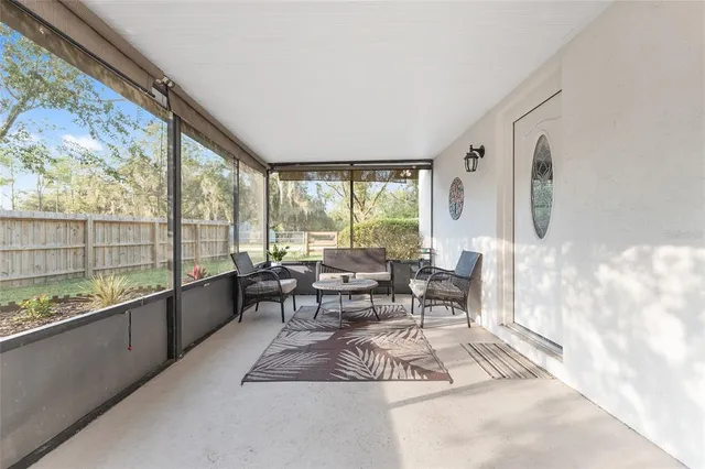 a view of a house with a tree in the background
