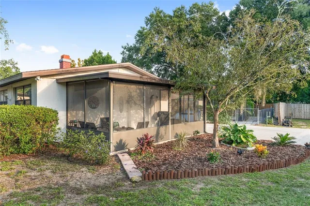 a backyard of a house with lots of green space