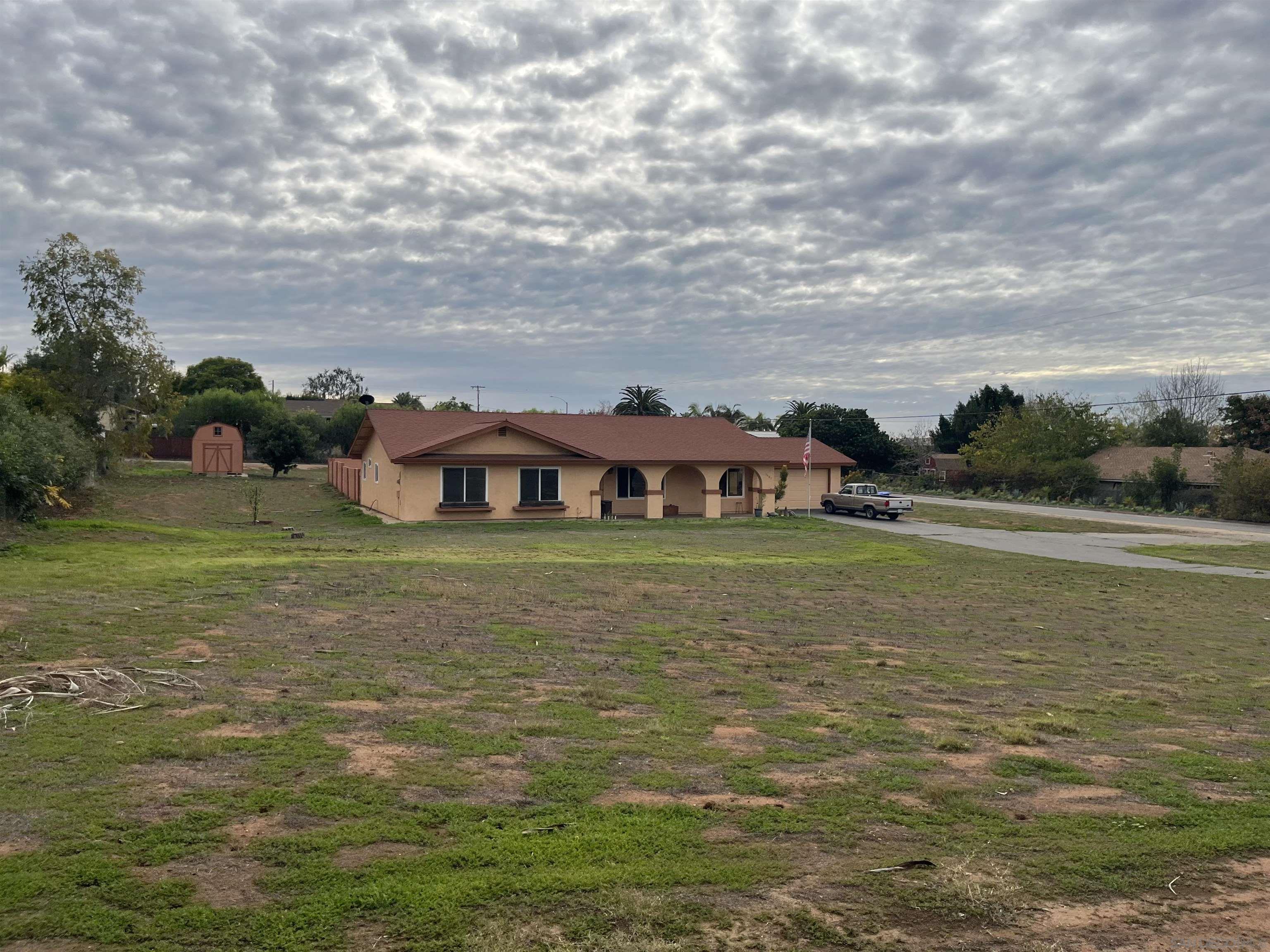 1407 Taylor Vista Vista, CA 92084 - Photo 1 of 28 a view of a lake with a big yard
