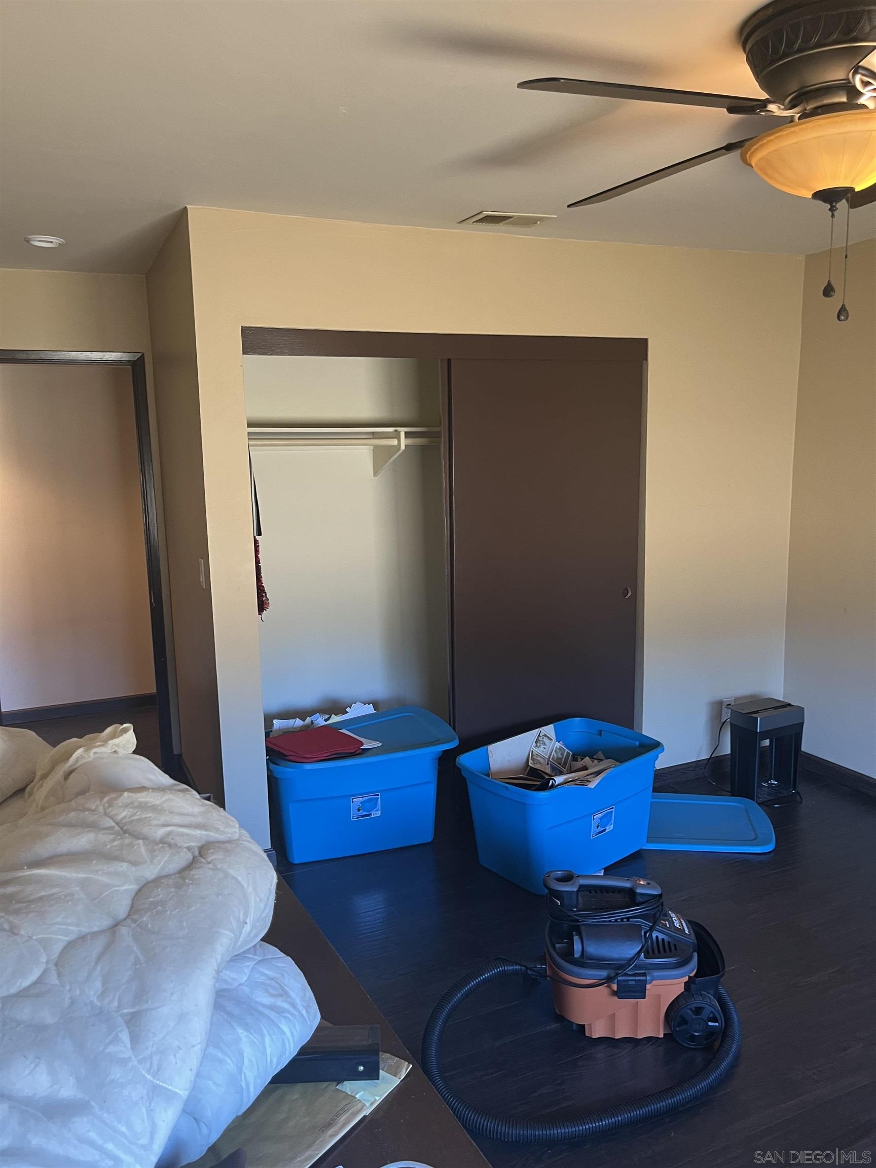 1407 Taylor Vista Vista, CA 92084 - Photo 15 of 28 a bedroom with a bed and wooden floor