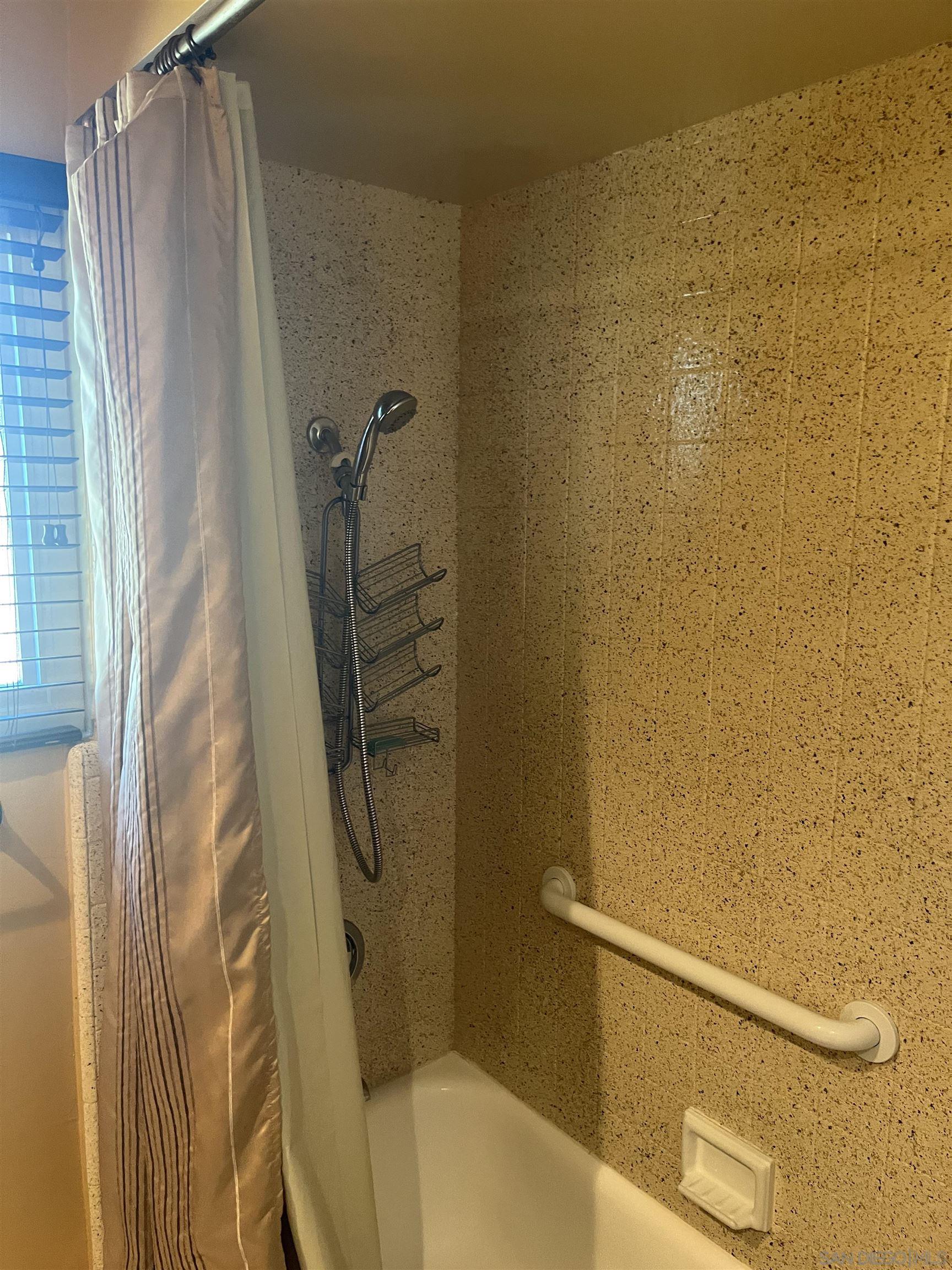 1407 Taylor Vista Vista, CA 92084 - Photo 19 of 28 a bathroom with a shower