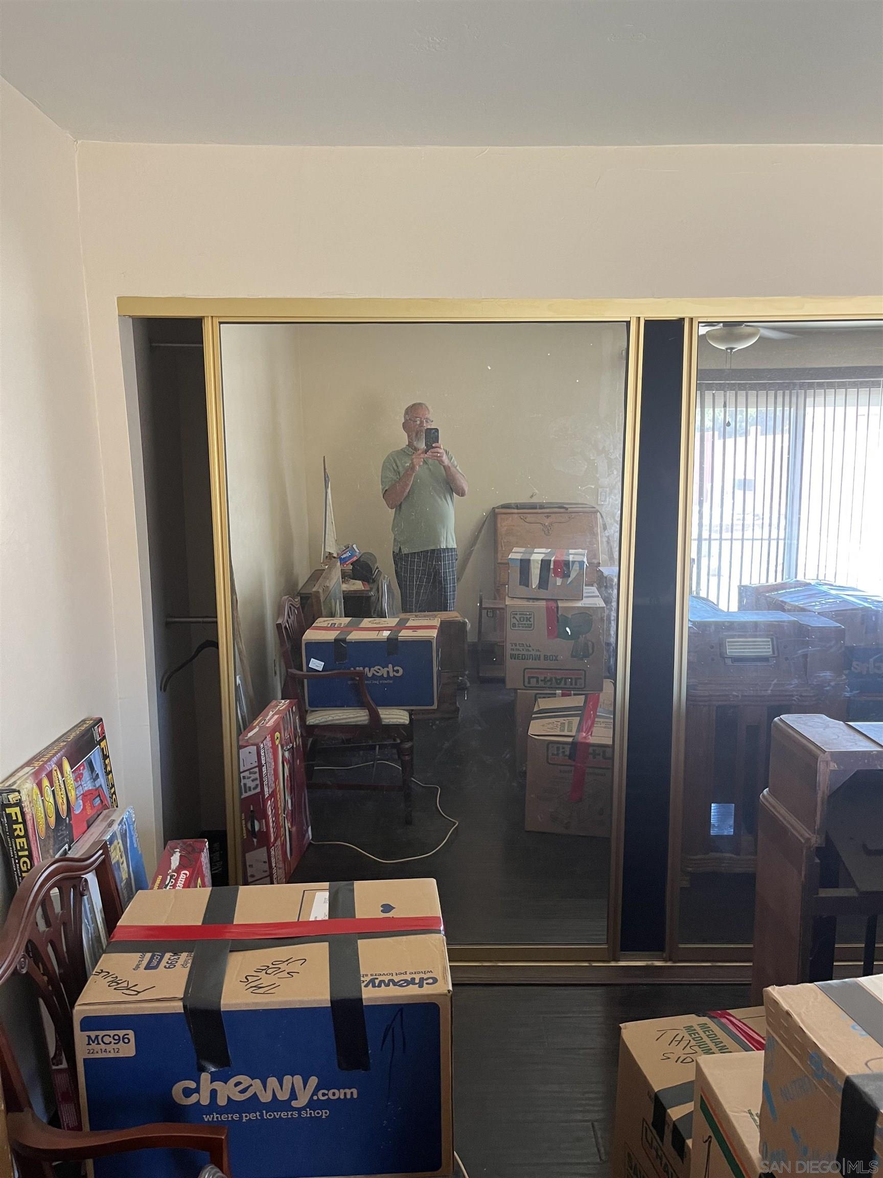 1407 Taylor Vista Vista, CA 92084 - Photo 21 of 28 a bedroom with a bed and a mirror