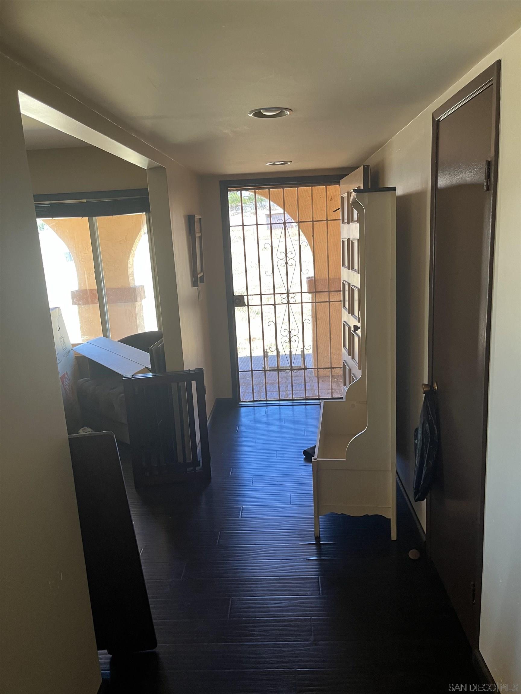 1407 Taylor Vista Vista, CA 92084 - Photo 26 of 28 a view of a livingroom with furniture wooden floor and a window