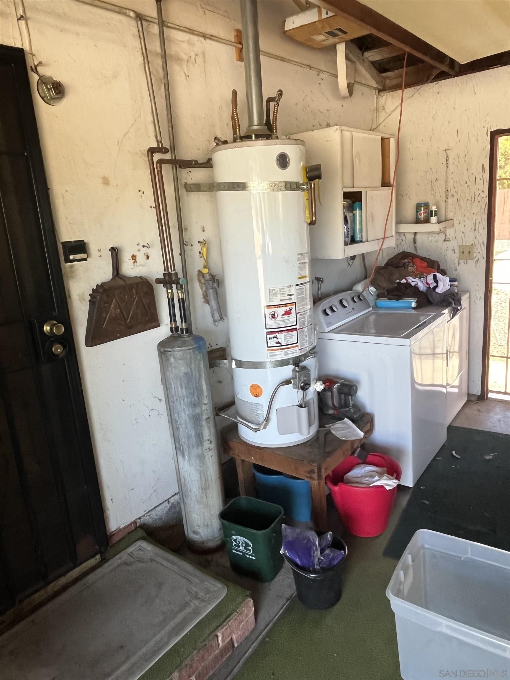 1407 Taylor Vista Vista, CA 92084 - Photo 28 of 28 a utility room with sink washer and dryer