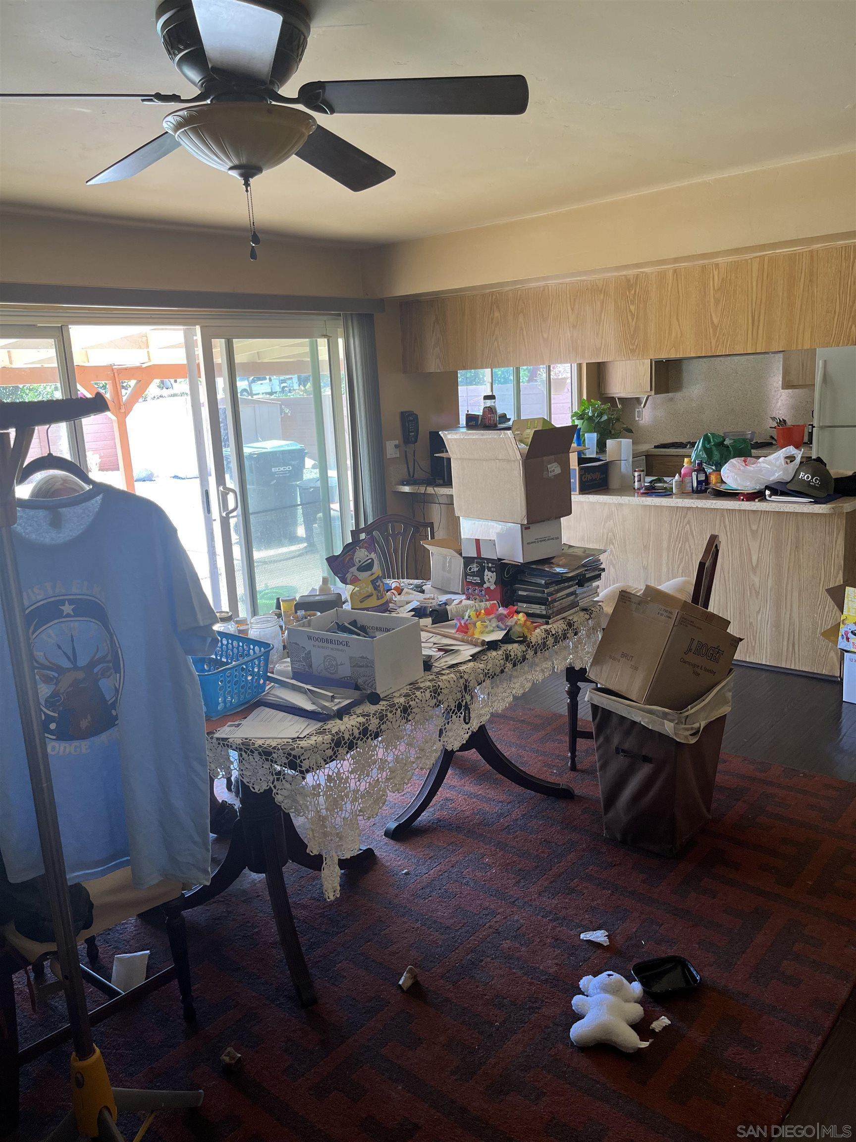 1407 Taylor Vista Vista, CA 92084 - Photo 8 of 28 a living room with furniture and a floor to ceiling window