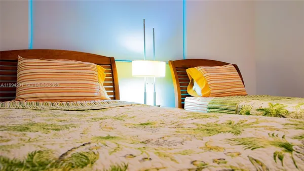 a view of a bedroom with a bed
