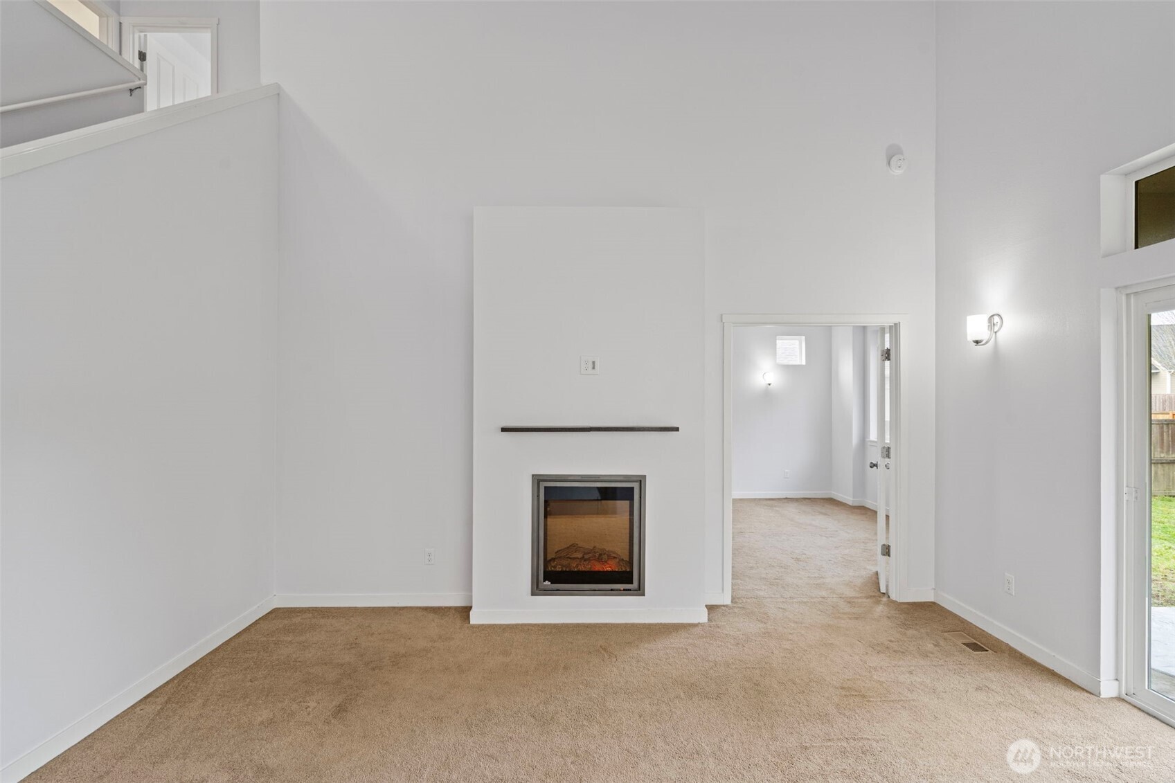 254 Parkside Loop Chehalis, WA 98532 - Photo 14 of 40 a view of an empty room with a fireplace and a window