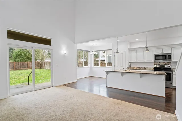 a bedroom with bed and a window