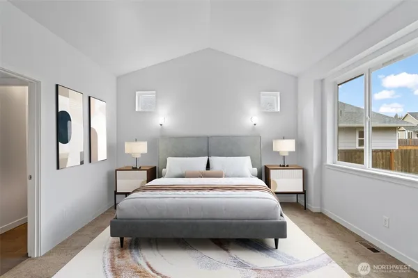 a bedroom with a bed a mirror and a window