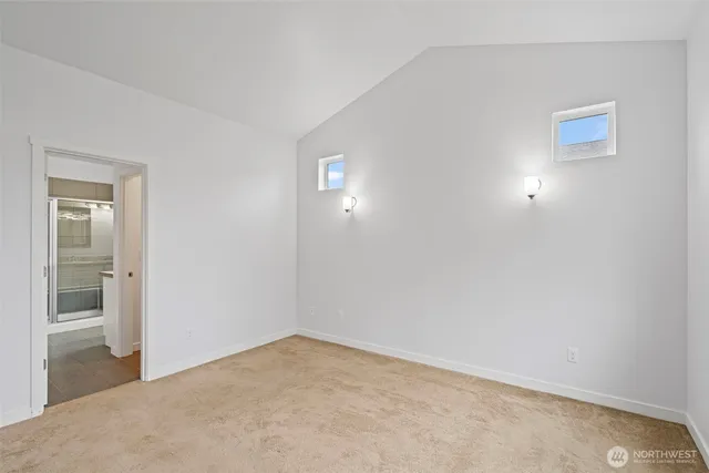 a bathroom with a granite countertop toilet sink and a mirror