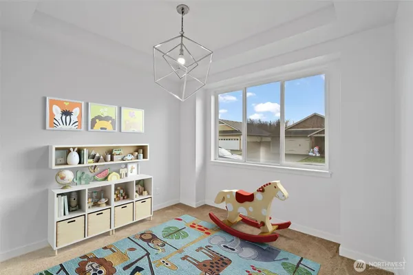 a spacious bedroom with a bed and glass window