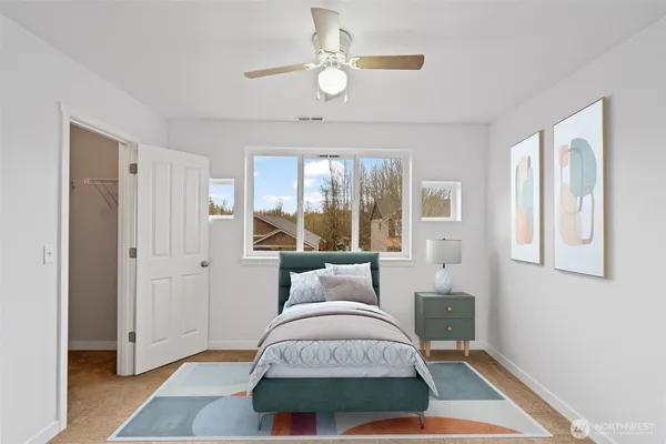a bedroom with a bed and a window