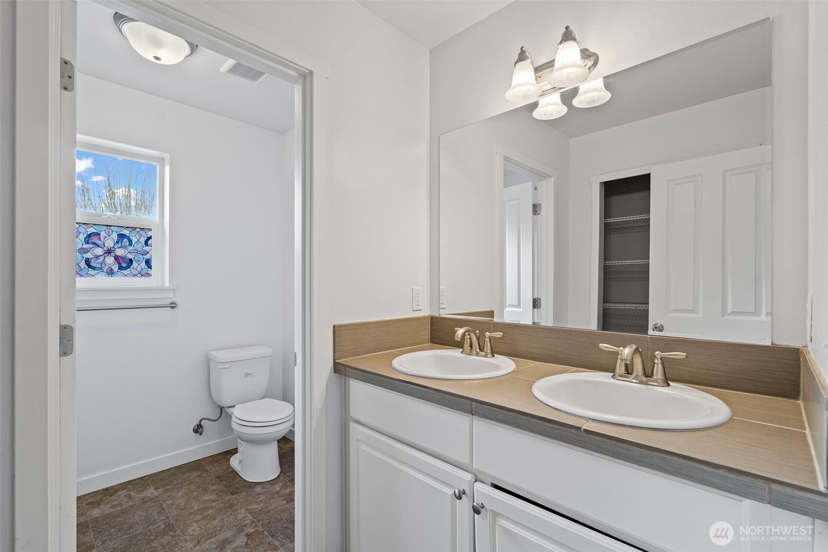 254 Parkside Loop Chehalis, WA 98532 - Photo 33 of 40 a bathroom with a granite countertop toilet sink and a mirror