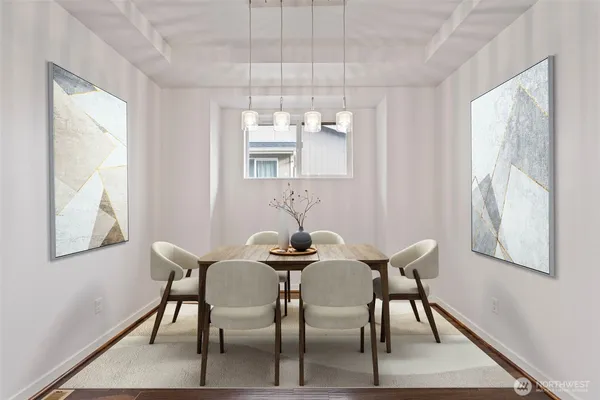 a view of a dining room with furniture and wooden floor