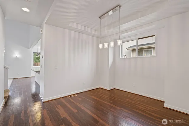 a kitchen with granite countertop a sink and stove