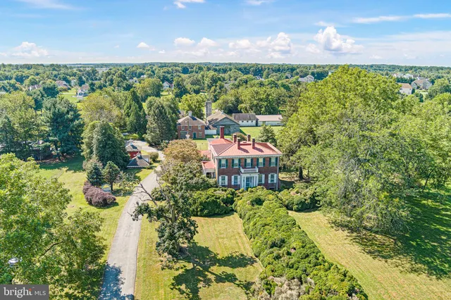 a view of a garden with an outdoor seating