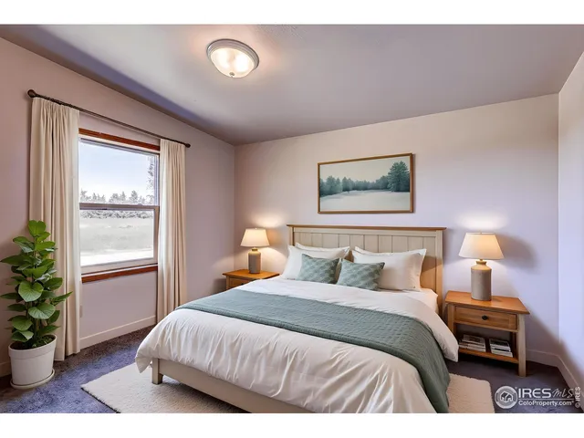 a bedroom with a bed and a potted plant