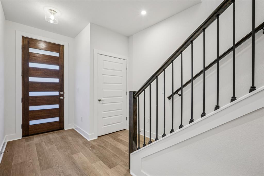 200 West 56th Street, Unit 8103 Austin, TX 78751 - Photo 5 of 13 a view of staircase with lots of frames on wall
