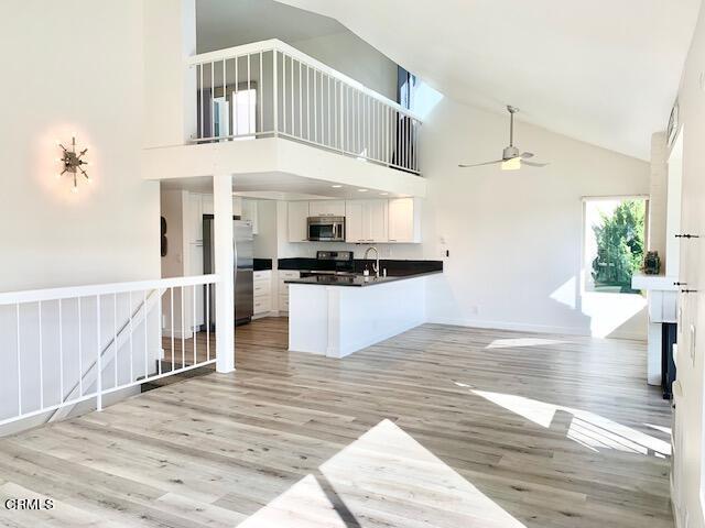a view of kitchen with cabinets and wooden floor