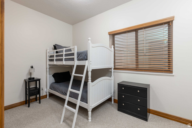 5168 Fairview Loop, Unit C604 Eden, UT 84310 - Photo 34 of 53 Bedroom with light carpet
